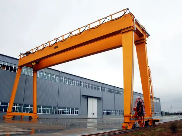 100 t European double girder gantry crane standing on its rails in an outdoor yard
